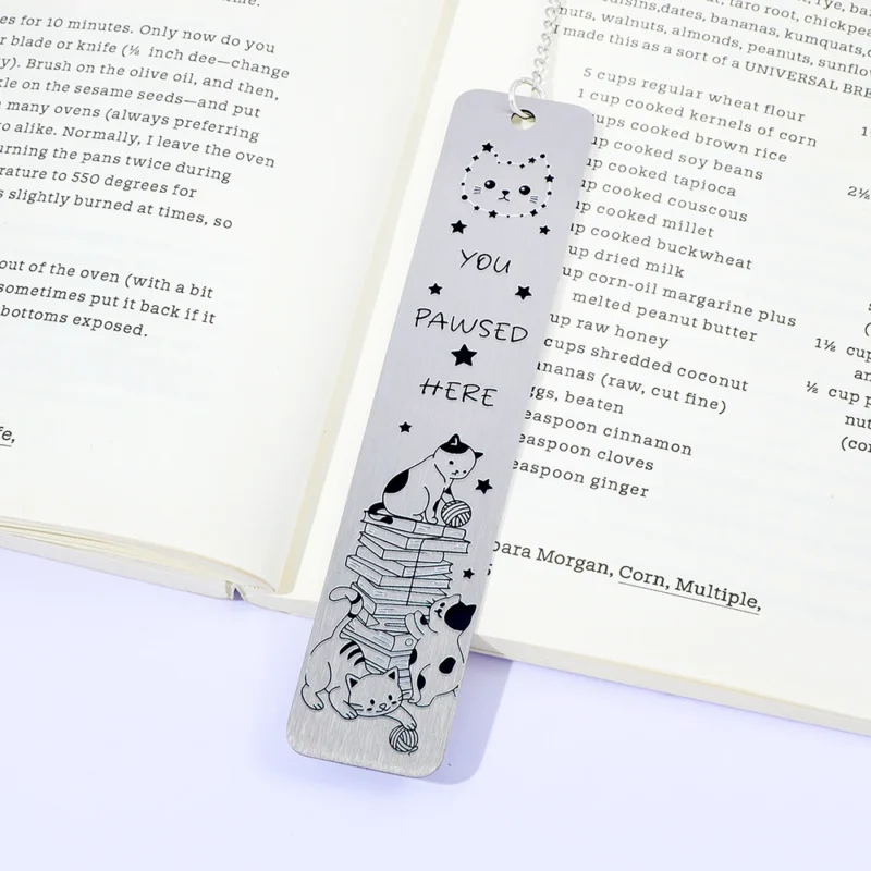 Cat themed metal bookmark with hanging accessories, a great reading assistant for poop scoopers and cute fans.